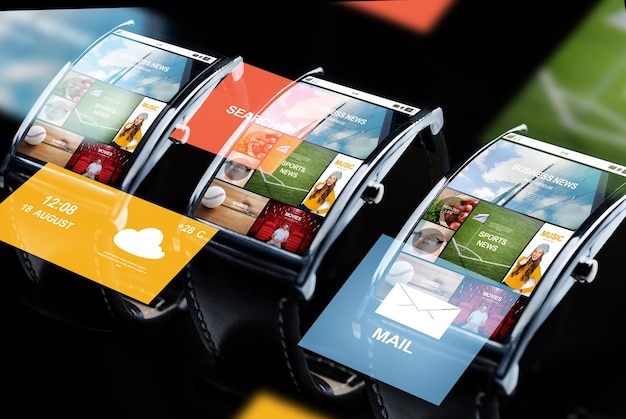 modern technology, object and media concept - close up of black smart watch set with news application on screen