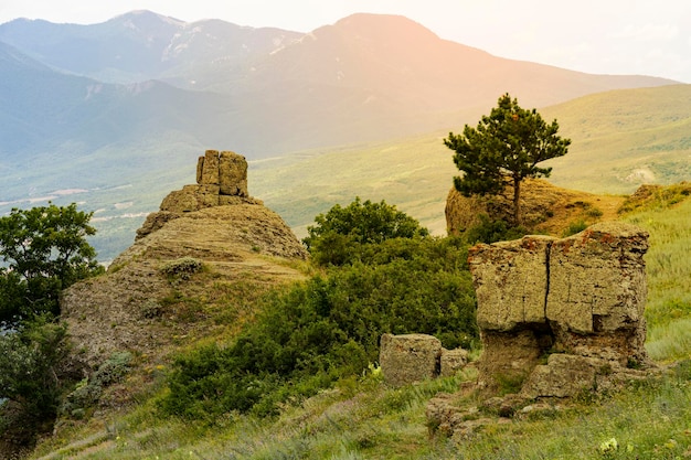 Mountain landscape stone pillars in the form of ghosts stone idols in a mountain valley a canyon against the sky