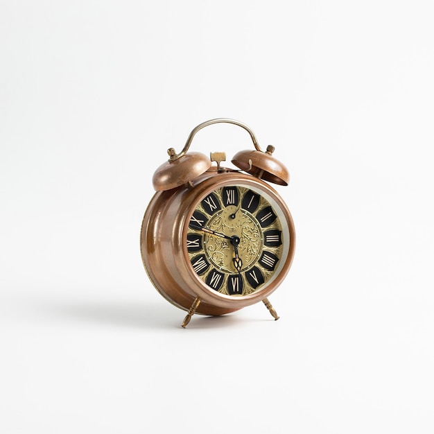 Old vintage alarm on a white background