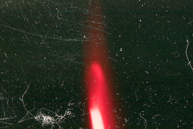 Overlay effect of red light on a scratched surface