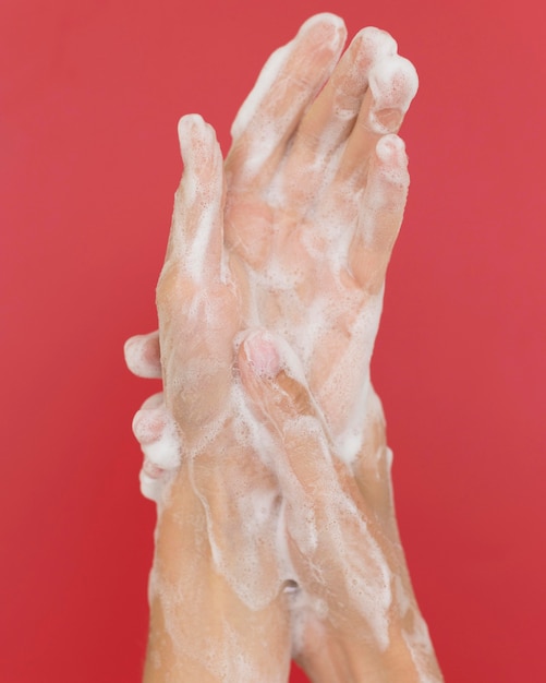 Person washing hands with soap