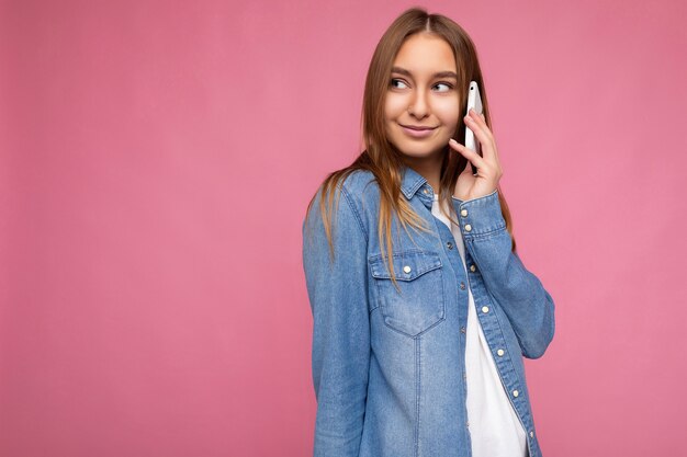 Photo of Attractive positive young blonde woman wearing casual blue jean shirt