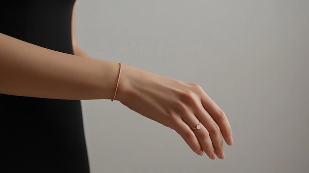 Photo photograph of a hand with a bracelet in a minimalist style on the wrist there is an elegant rose