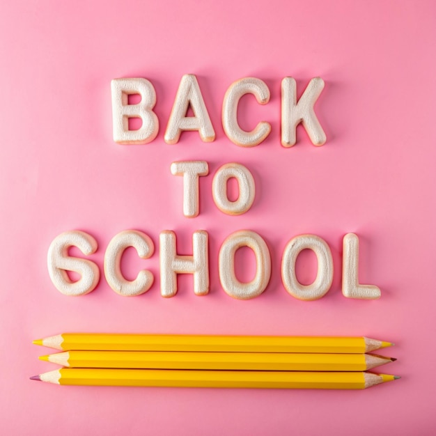 a pink wall with the words back to school written on it