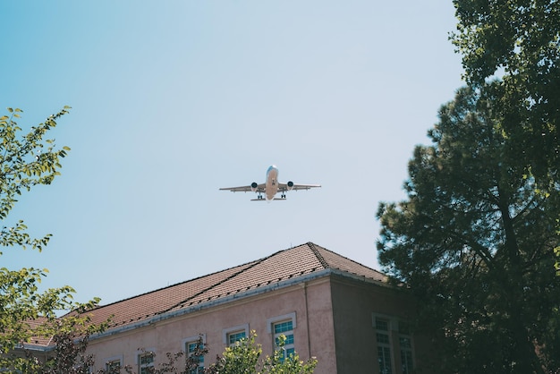 Plane flying over residential building