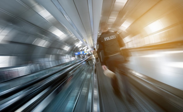 Police man at a walking on a airport