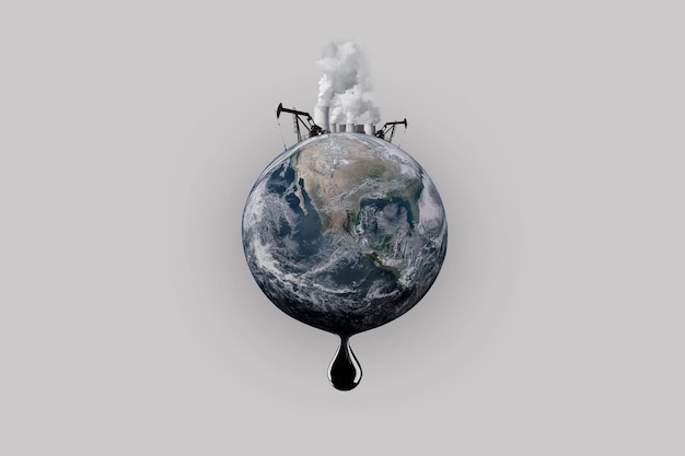 Pollution of the planet earth Oil production pipes with smoke a drop of oil The end of oil reserves