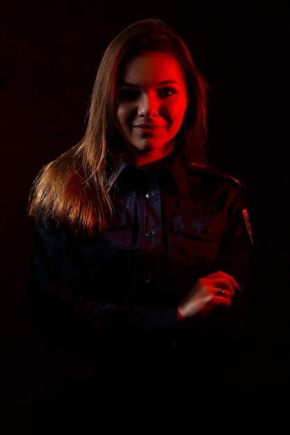 Portrait of a beautiful girl in police uniform. Professional posing