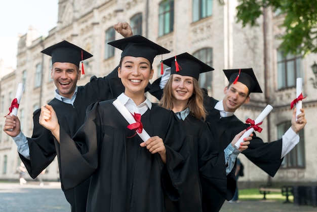 Portrait of group of students celebrating their graduation