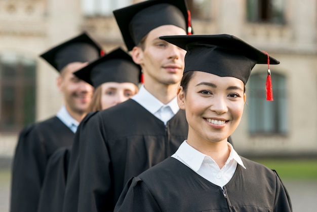 Portrait of group of students celebrating their graduation