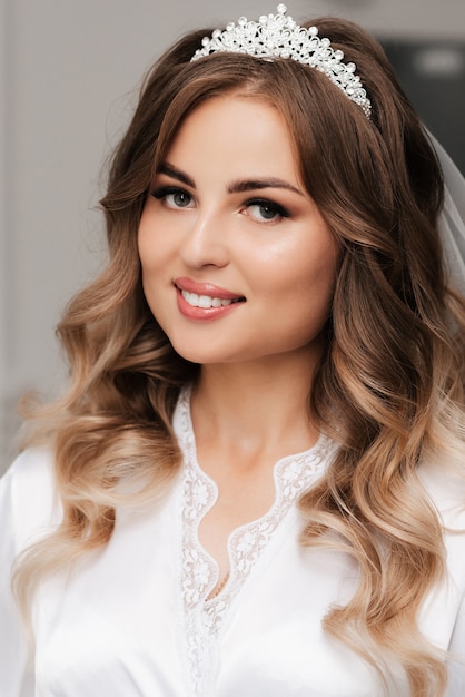 Portrait of a happy girl bride with makeup and styling smiling