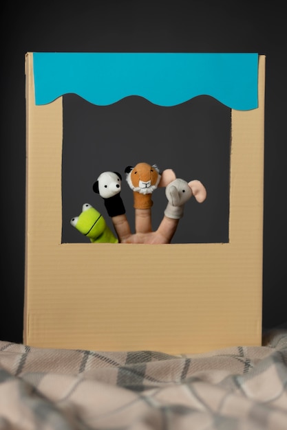 Puppet show in cardboard arrangement