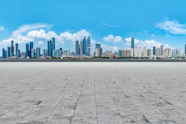 Qingdao city skyscrapers with empty square floor tiles