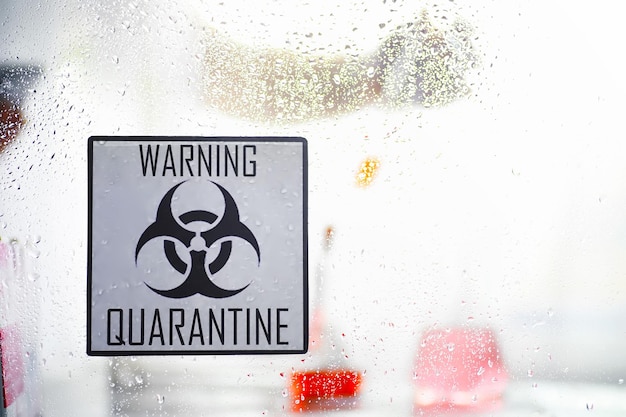 Quarantine Quarantine warning sign on a glass door in a hospital isolator Isolation of patients with the virus in special laboratories Virus