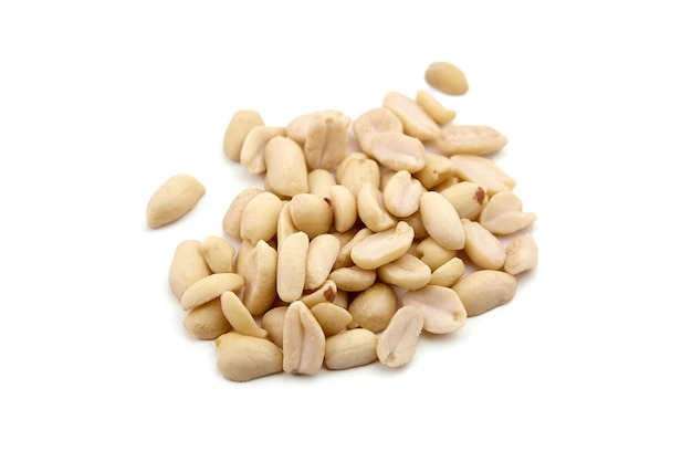 Raw blanched peanuts isolated on white background