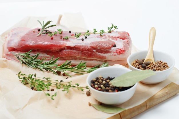 Raw pork meat with herbs