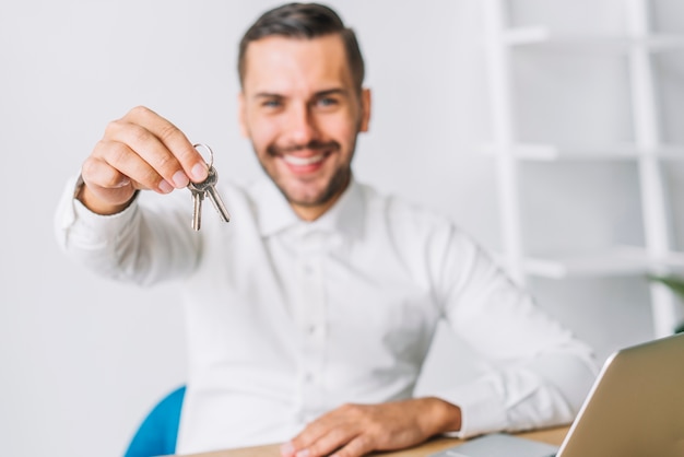 Real estate agent holding keys