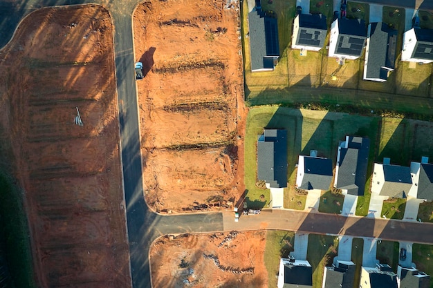 Real estate development with tightly located family houses under construction in South Carolina suburban area Concept of growing american suburbs