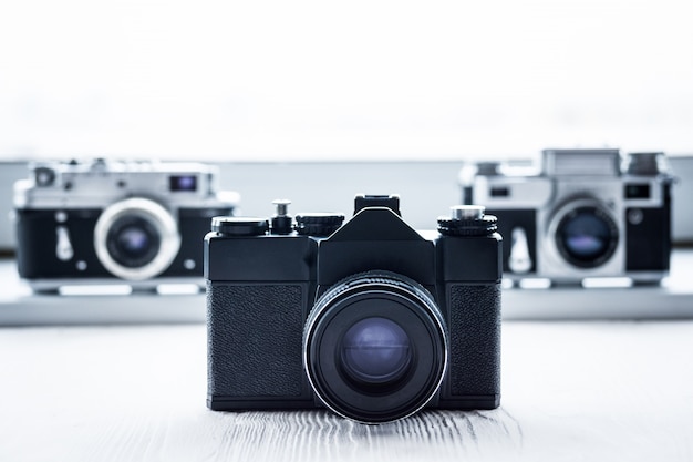 Retro cameras on white background