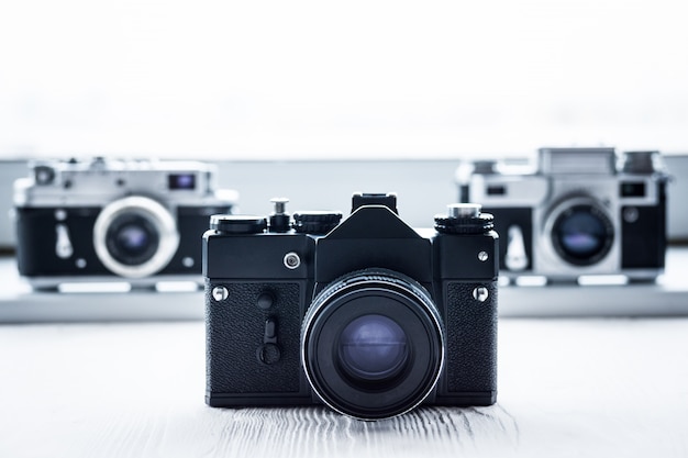 Retro cameras on white background