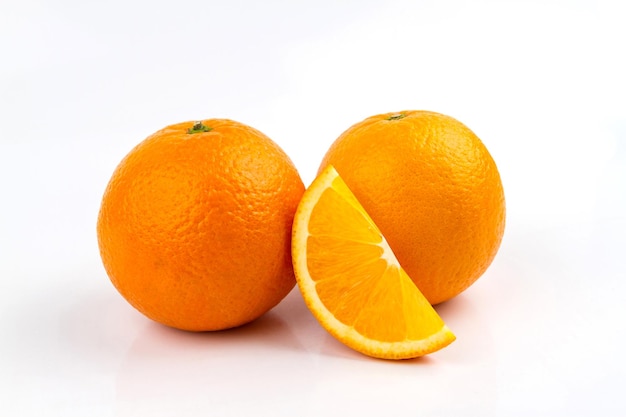 Ripe orange fruit on white background Round orange slice