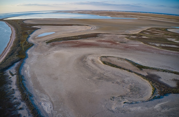 Sandy swamp near a beautiful lake, drone camera