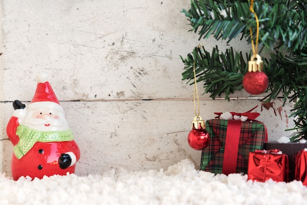 santa claus on the snow with christmas tree in vintage background