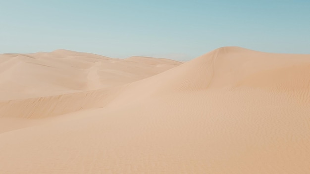 Photo scenic view of desert against clear sky