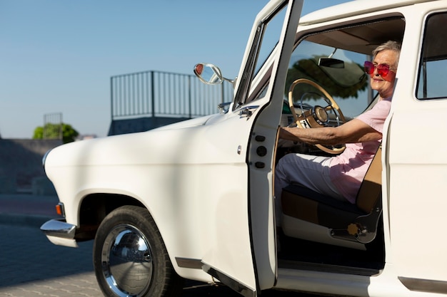 Senior woman traveling by car