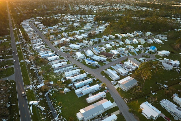 Severely damaged houses after hurricane Ian in Florida mobile home residential area Consequences of natural disaster