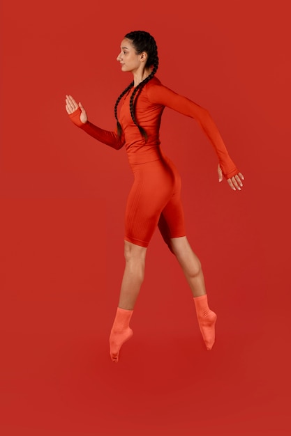 Side view woman posing with red outfit