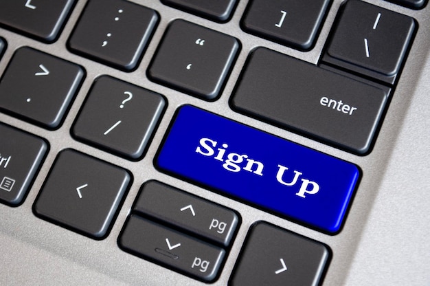 Photo sign up text on blue keyboard sign up and online registration concept