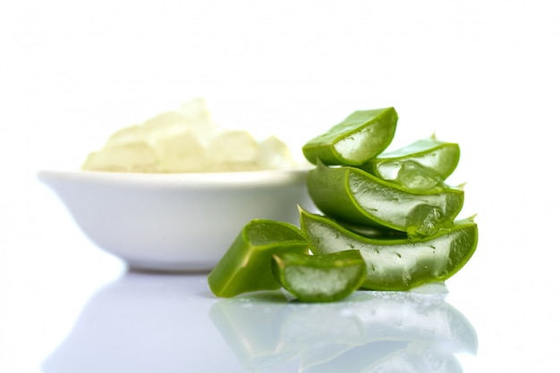 Slices of Aloe Vera leaves and Aloe Vera gel . Aloe Vera is a very useful herbal medicine for skincare and hair care.