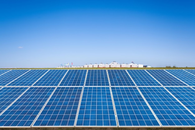 Photo solar energy panel on prairie with blue sky and yurt in inner mongolia china