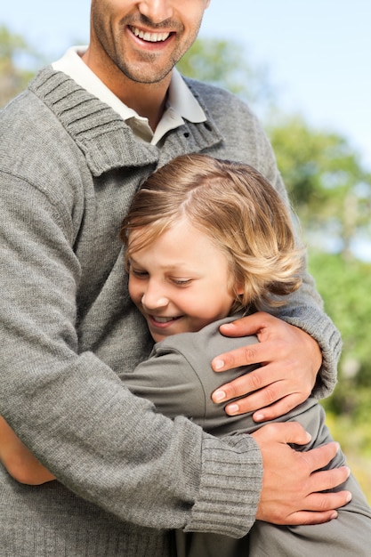 Son embracing his father