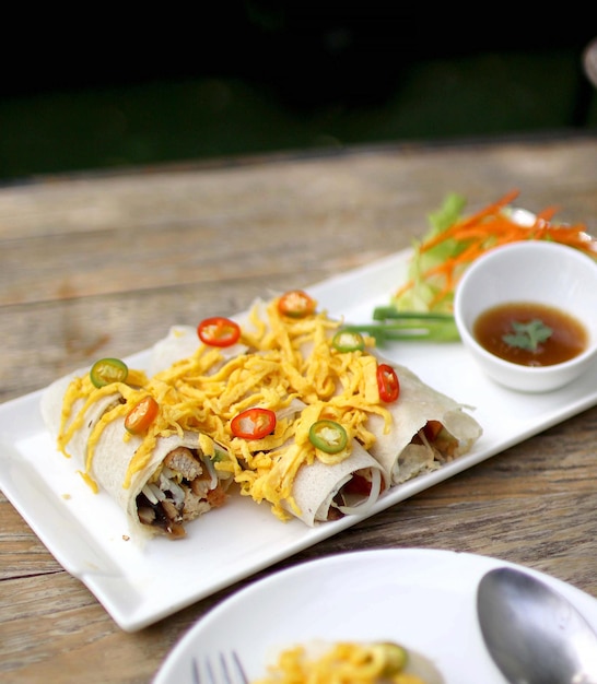 Spring roll on wooden table