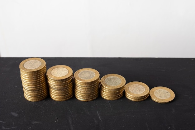 stack of mexican peso coins on the table