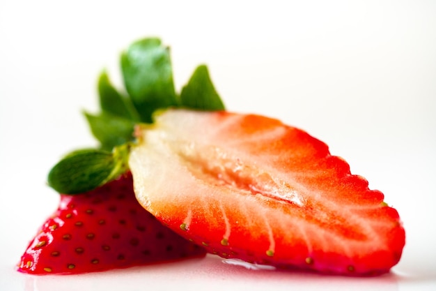 Strawberries on a white background. Isolated strawberry.Sliced berry.Sliced strawberries