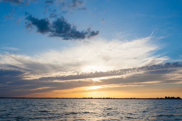 Sunset over water from Delta del Po water and sky