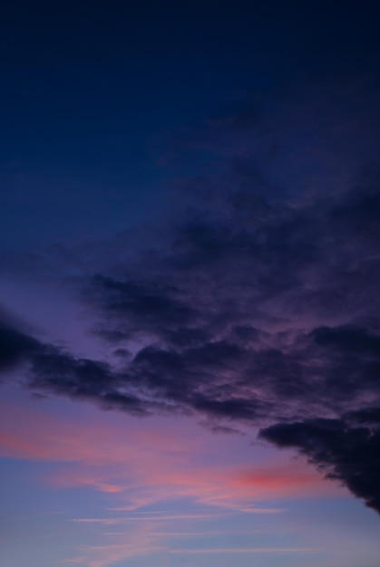 Sunset with a colorful sky in orange, purple and dark blue, Vertical twilight in the evening with a beautiful dusk sky sunlight in Autumn