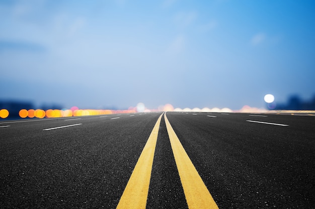 Synthetic material, asphalt road and sky