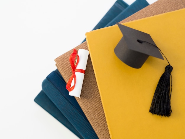 Top view academic cap on books