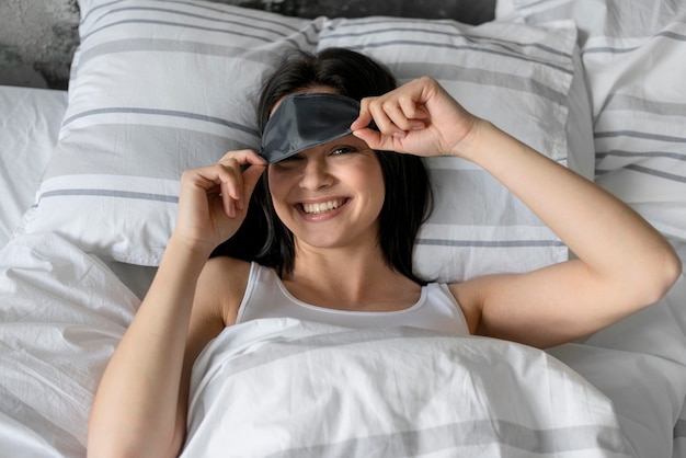 Top view beautiful woman with sleep mask