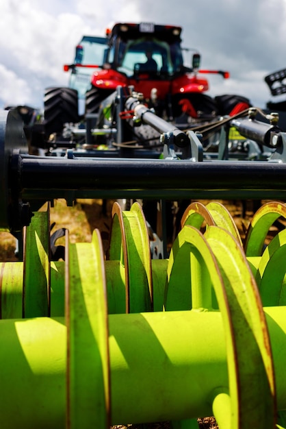 Photo tractor with equipment for field processing the theme of farming and agriculture