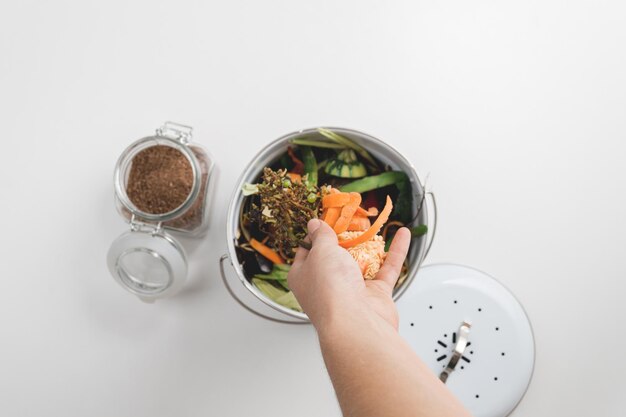 Photo trash bin for composting with leftover from kitchen