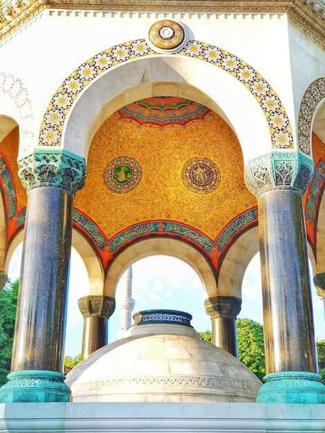 Travel to turkey concept a low angle shot of the german fountain in istanbul arabic architecture