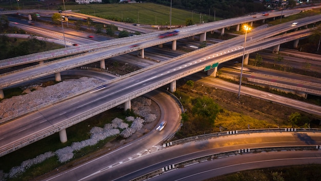 Twilight landscape long exposure movement traffic car on  expressway interchange in Thailand 