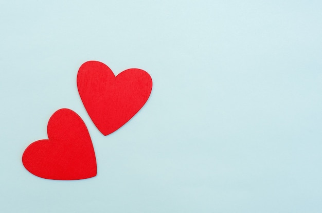 Two red hearts on a blue background