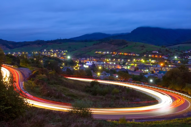 Ukrainian Village in the Valley and Evening Turn of the Mountain Road