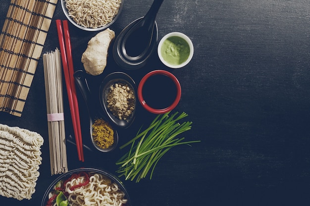 Variety Defferent Many Ingredients for Cooking Tasty Oriental Asian Food. Top View with Copy Space. Dark Background. Above. Toning.